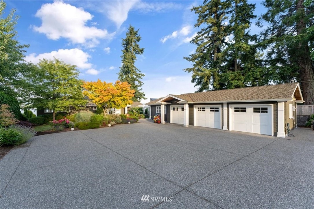 1707 Vernon Road Lake Stevens, WA 98258 - Photo 37 of 40 a front view of a house with a yard and trees