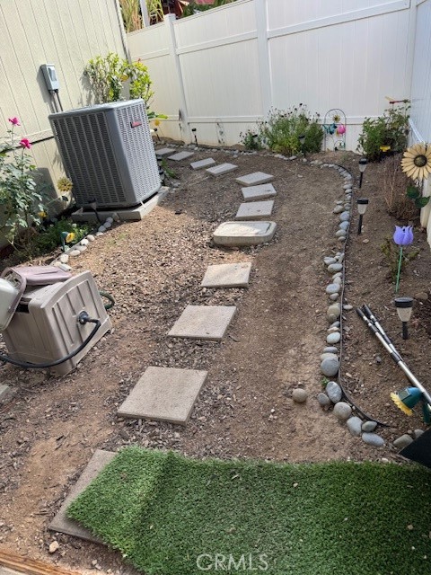 30000 Hasley Canyon Road, Unit 9 Valencia, CA 91384 - Photo 21 of 26 Back side yard walkway - low maintenance