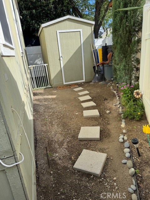 30000 Hasley Canyon Road, Unit 9 Valencia, CA 91384 - Photo 22 of 26 Walkway in back yard
