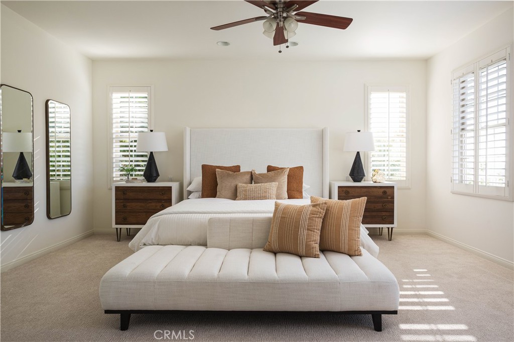 16 Via Elda San Clemente, CA 92673 - Photo 17 of 32 a bedroom with a large bed and a chandelier