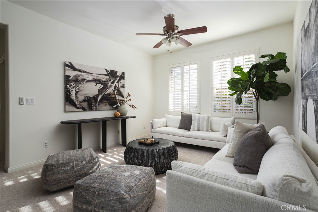 16 Via Elda San Clemente, CA 92673 - Photo 24 of 32 a living room with furniture a chandelier and a window