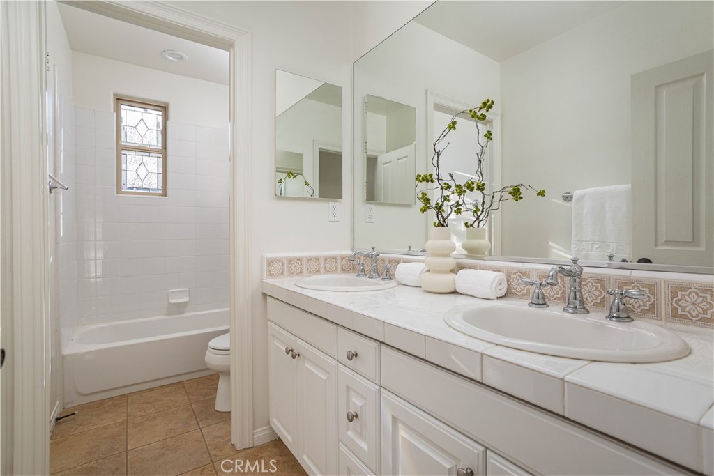 16 Via Elda San Clemente, CA 92673 - Photo 26 of 32 a bathroom with a granite countertop sink a toilet and shower