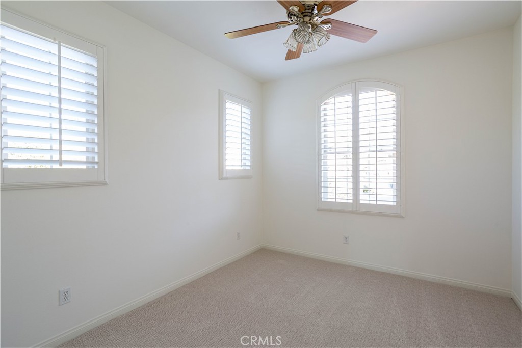 16 Via Elda San Clemente, CA 92673 - Photo 27 of 32 an empty room with a window and a fan