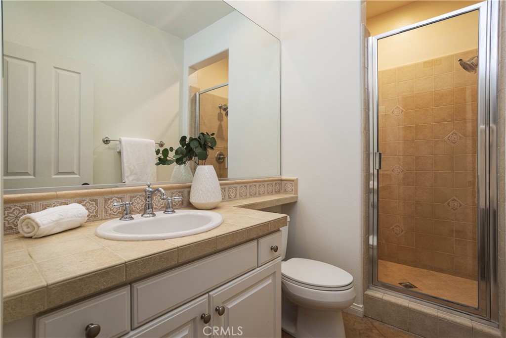 16 Via Elda San Clemente, CA 92673 - Photo 30 of 32 a bathroom with a sink toilet and shower