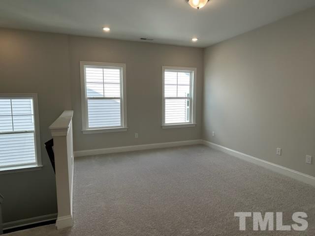 192 Edge Of Auburn Boulevard Raleigh, NC 27610 - Photo 16 of 44 a view of an empty room with a window