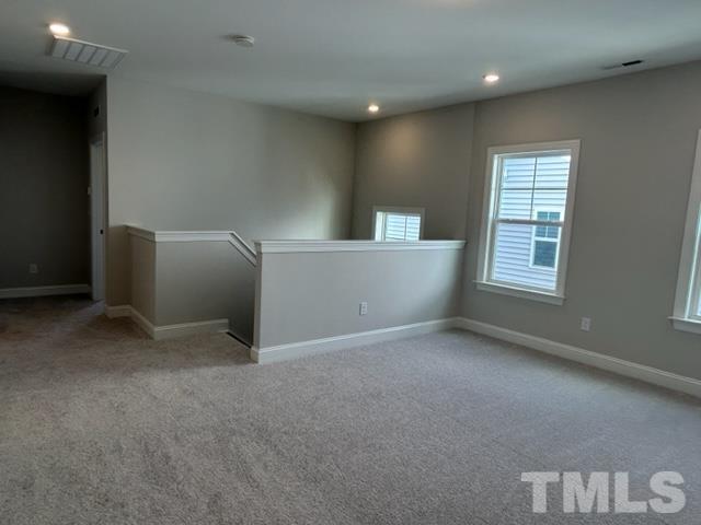 192 Edge Of Auburn Boulevard Raleigh, NC 27610 - Photo 18 of 44 a view of an empty room with a window