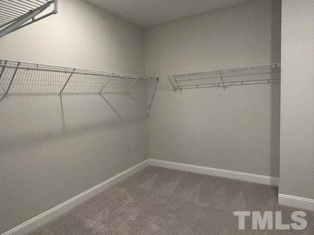 192 Edge Of Auburn Boulevard Raleigh, NC 27610 - Photo 23 of 44 a view of a room with racks on the wall