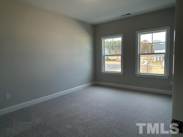 192 Edge Of Auburn Boulevard Raleigh, NC 27610 - Photo 25 of 44 an empty room with windows