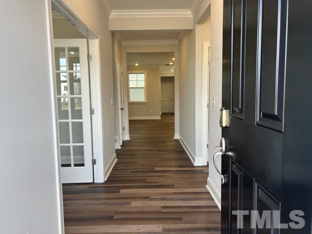192 Edge Of Auburn Boulevard Raleigh, NC 27610 - Photo 3 of 44 a view of a hallway with wooden floor and staircase
