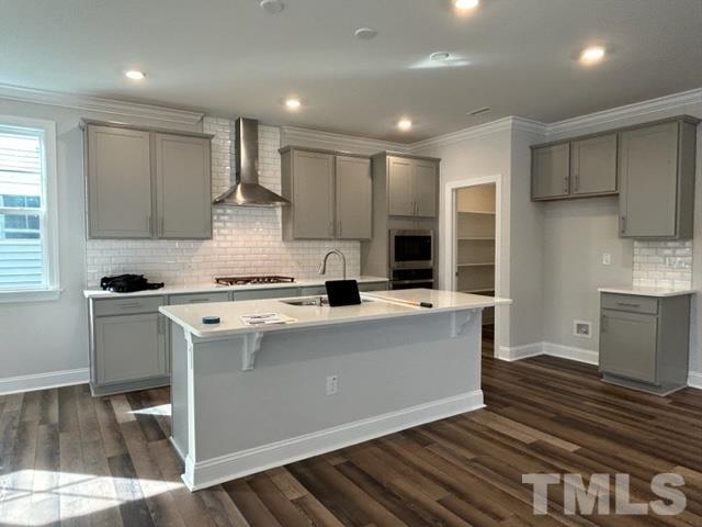 192 Edge Of Auburn Boulevard Raleigh, NC 27610 - Photo 8 of 44 a kitchen with a stove a sink and a refrigerator