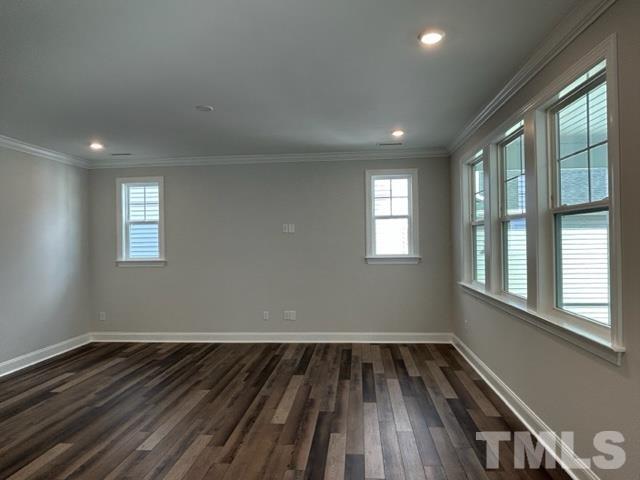 192 Edge Of Auburn Boulevard Raleigh, NC 27610 - Photo 10 of 44 a view of wooden floor and windows in a room