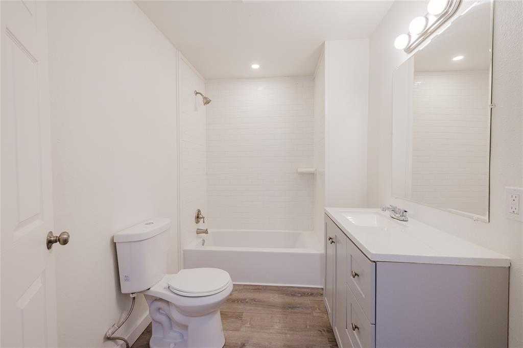 524 West Roberts Street Gorman, TX 76454 - Photo 19 of 35 a bathroom with a sink a toilet and shower