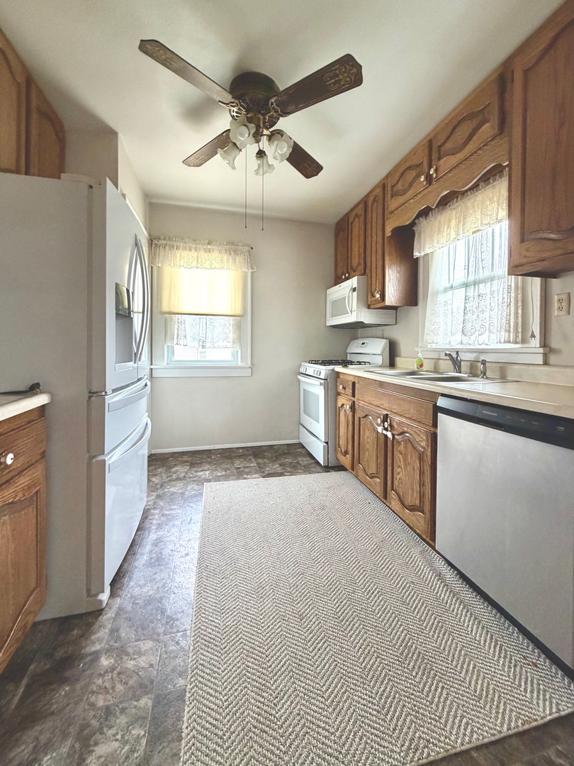 422 45th Street Moline, IL 61265 - Photo 8 of 22 a kitchen with a sink stove and cabinets
