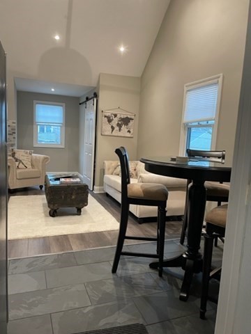10 Shore Road Plymouth, MA 02360 - Photo 27 of 36 a living room with furniture and a dining table