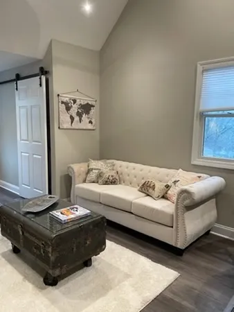 a living room with furniture and a couch