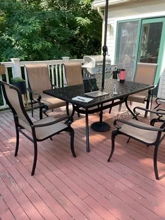 a view of a outdoor sitting area with furniture