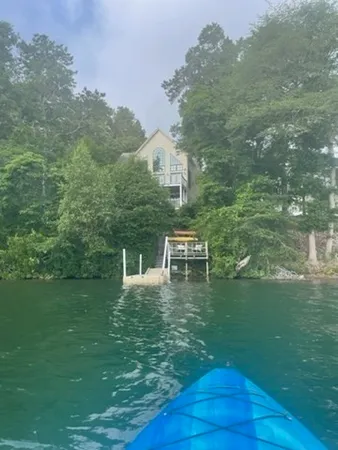 a view of a lake with a yard