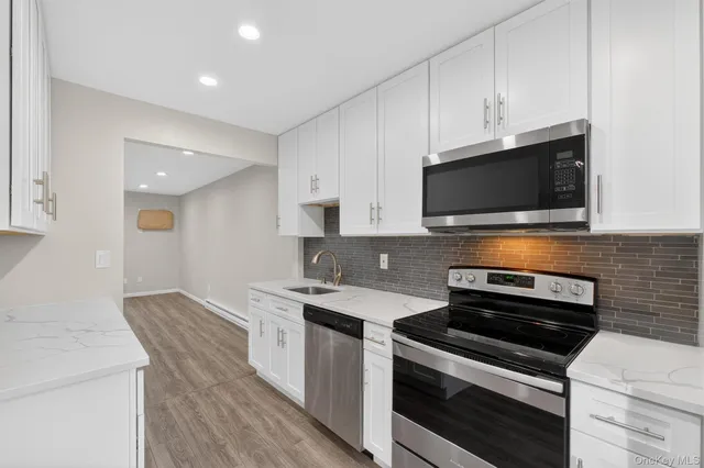 a kitchen with a stove and a microwave