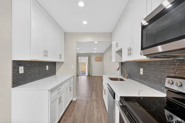 a kitchen with a stove and a sink