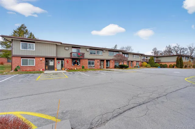 a view of a swimming pool with an outdoor seating