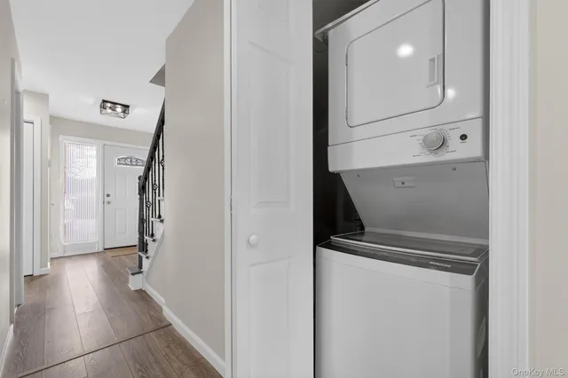 a view of hallway with wooden floor