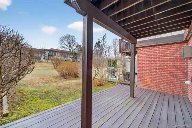 a view of a balcony with wooden floor