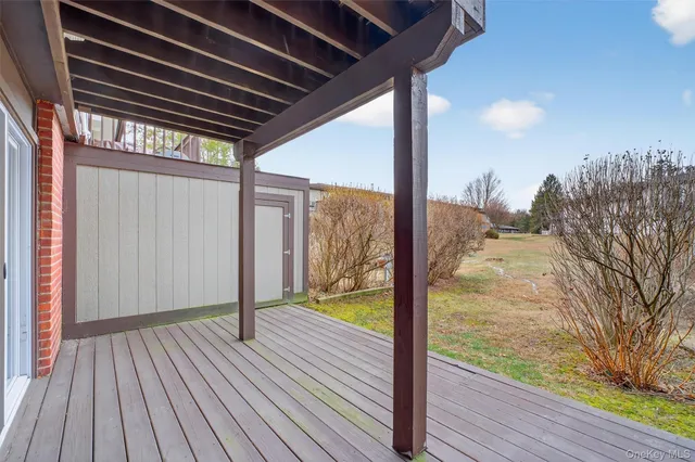 a view of balcony with wooden floor