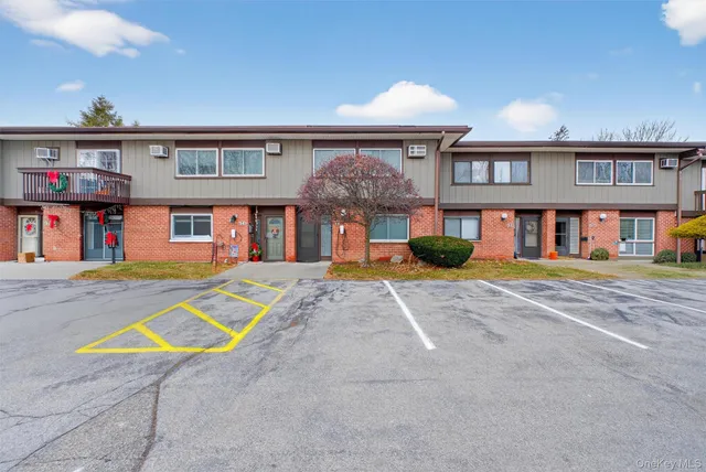 a view of pool with a lounge chairs