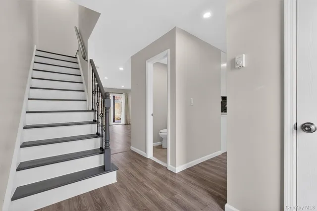 a view of entryway with wooden floor