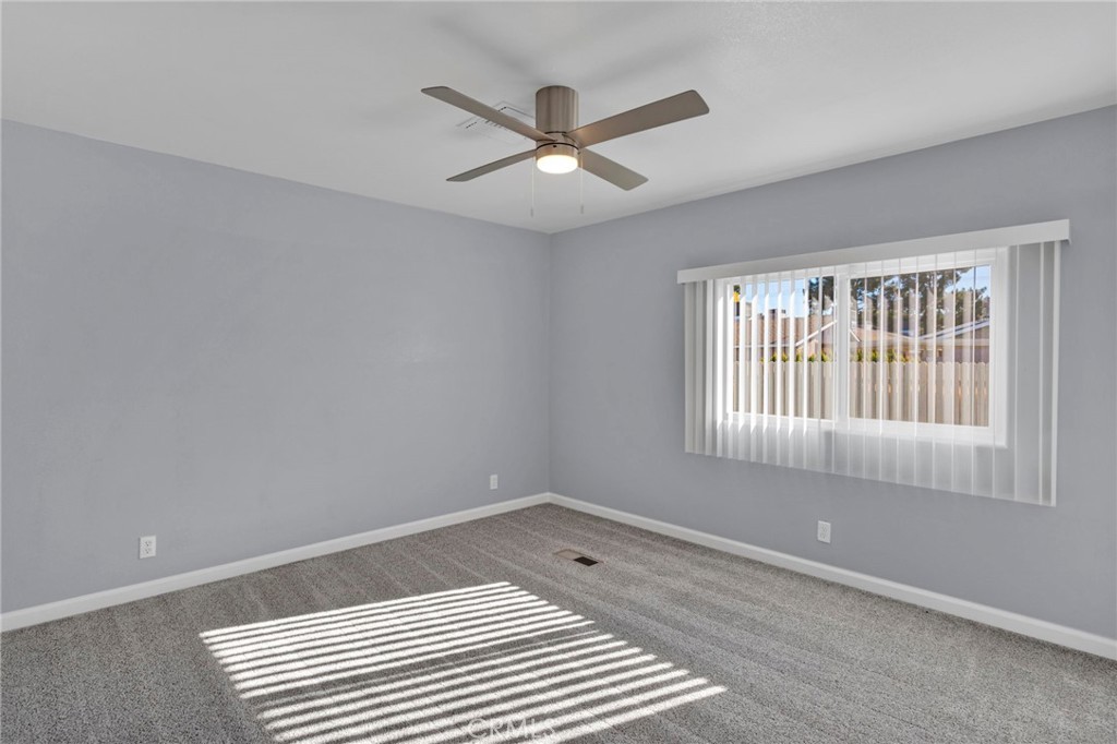 15252 Seneca Road, Unit 221 Victorville, CA 92392 - Photo 12 of 29 a view of an empty room with a window