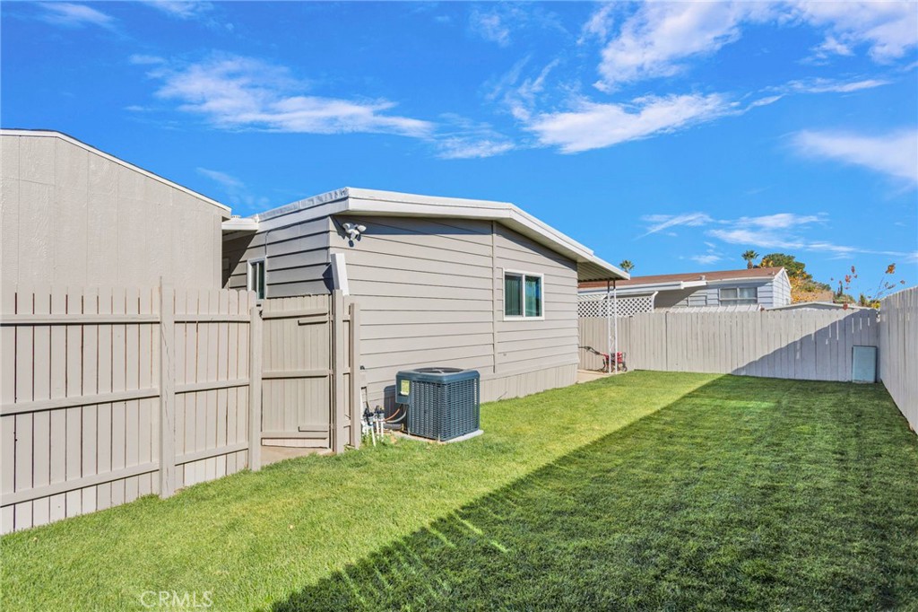 15252 Seneca Road, Unit 221 Victorville, CA 92392 - Photo 20 of 29 a view of a backyard with plants and a backyard