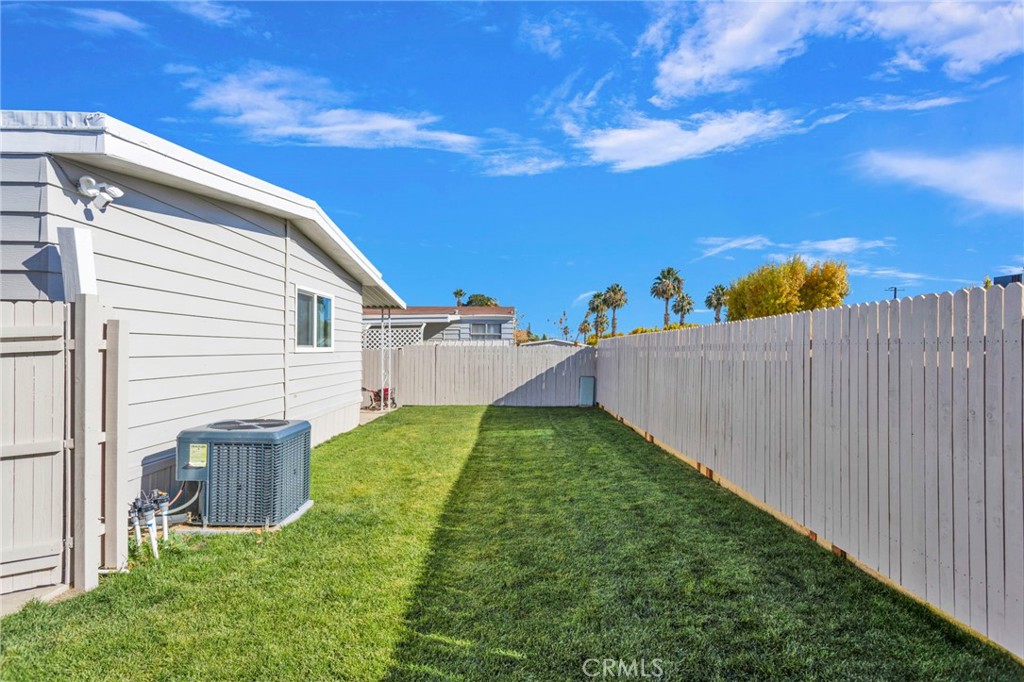 15252 Seneca Road, Unit 221 Victorville, CA 92392 - Photo 21 of 29 a view of a backyard with plants and a garden