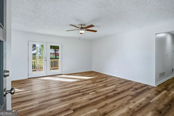a view of an empty room with a window