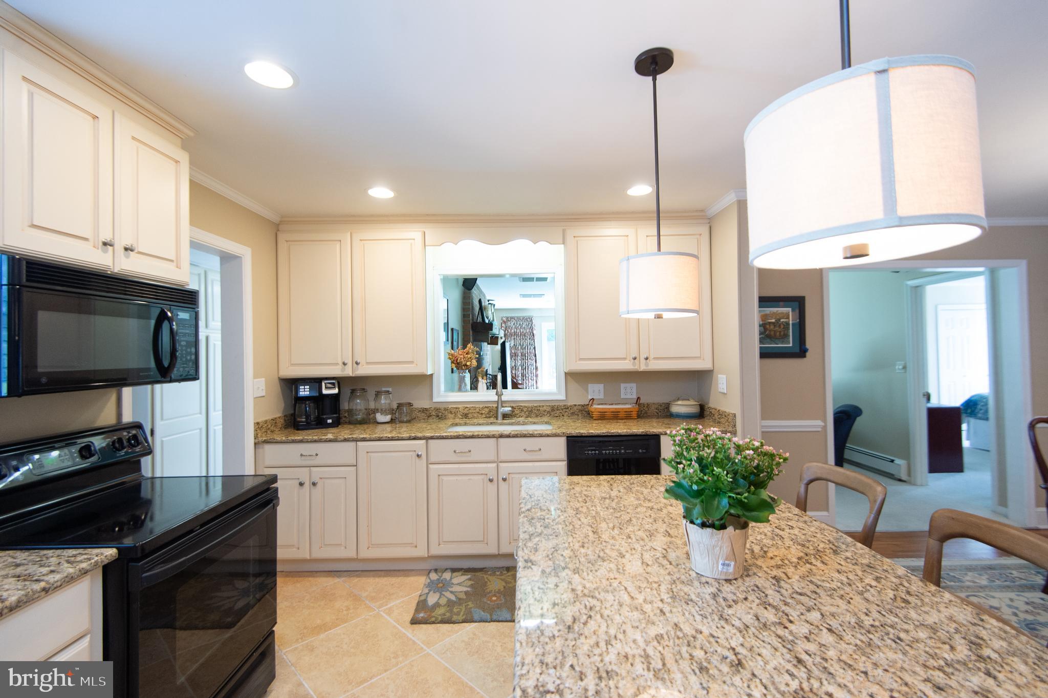 412 Talbot Avenue Cambridge, MD 21613 - Photo 10 of 32 a kitchen with sink cabinets and outdoor space