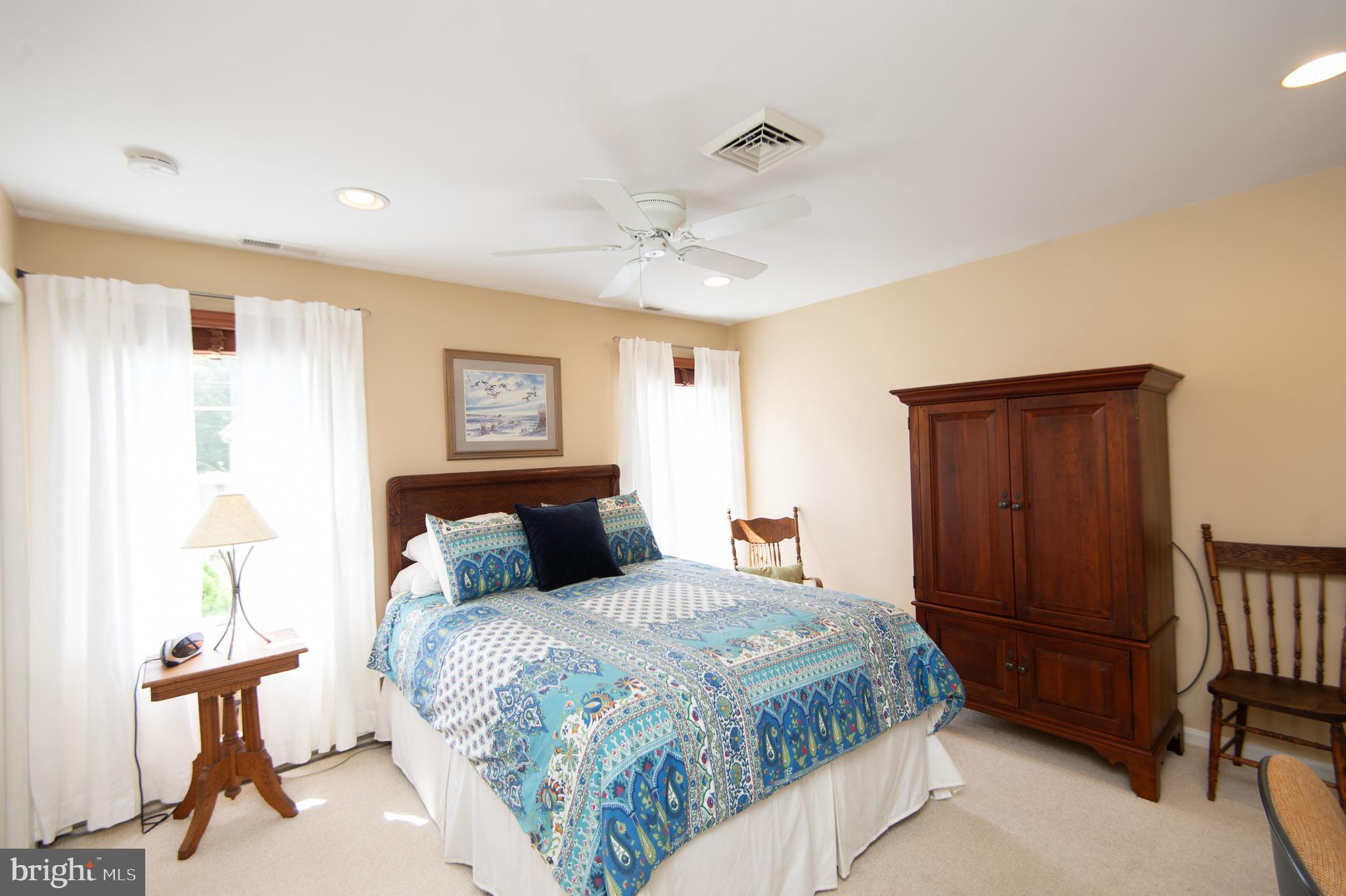 412 Talbot Avenue Cambridge, MD 21613 - Photo 15 of 32 a bedroom with a bed and a desk in it