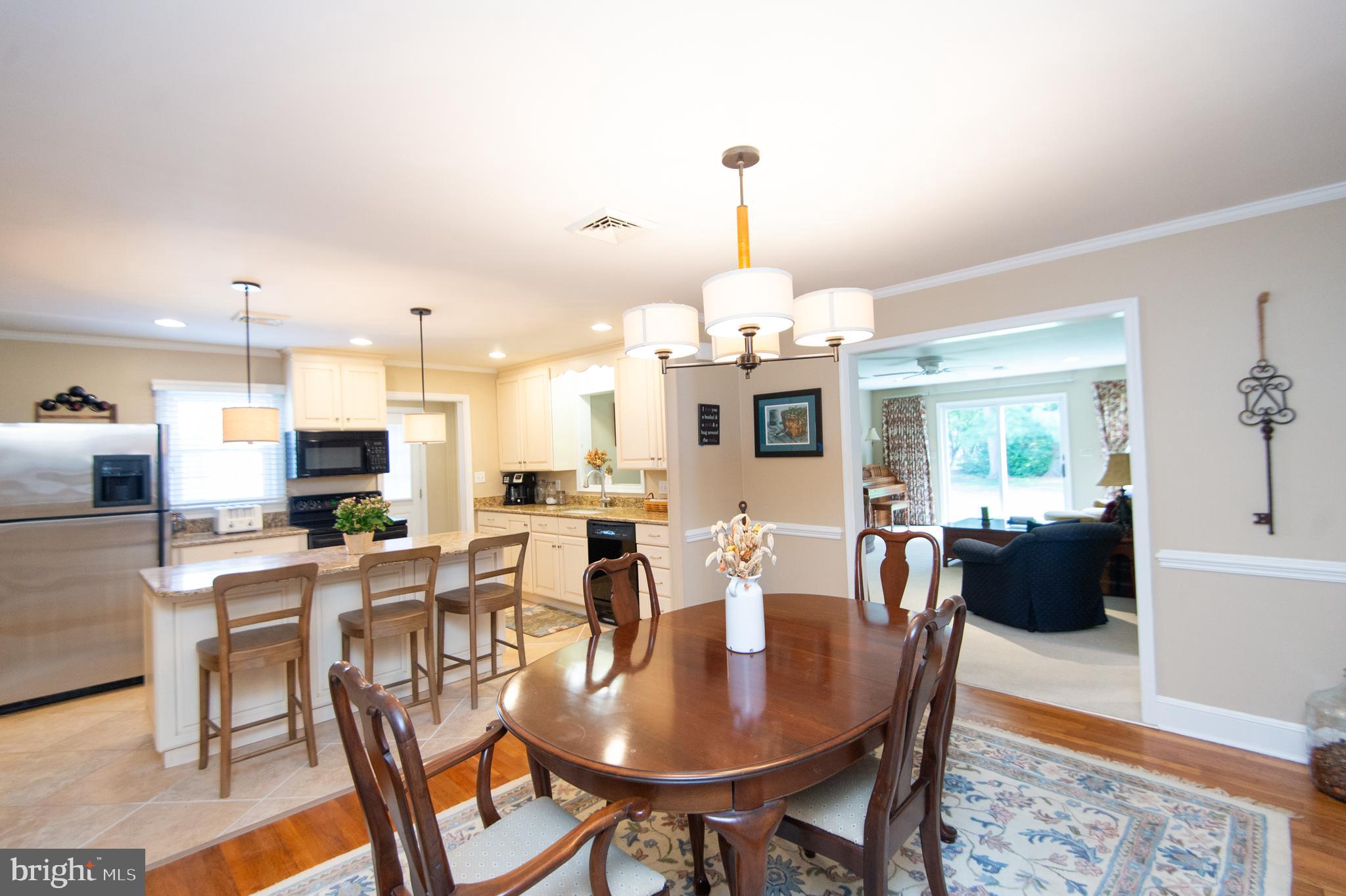 412 Talbot Avenue Cambridge, MD 21613 - Photo 6 of 32 a view of a dining room with furniture wooden floor and chandelier