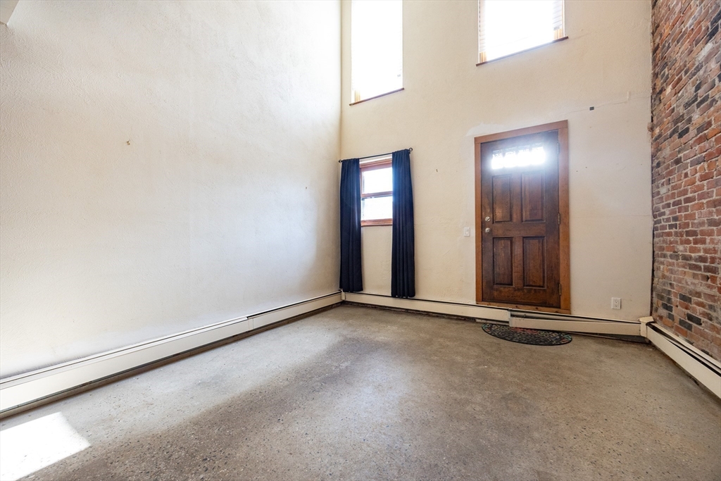 20 Beacon Street, Unit 2 Chelsea, MA 02150 - Photo 11 of 40 an empty room with windows