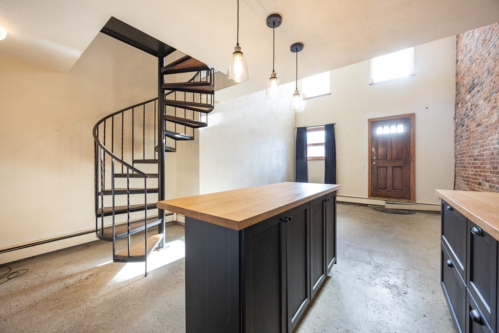 20 Beacon Street, Unit 2 Chelsea, MA 02150 - Photo 17 of 40 a view of a hallway with entryway and chandelier