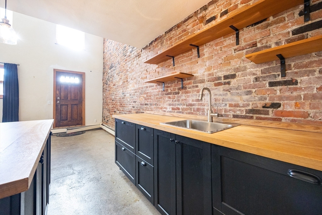 20 Beacon Street, Unit 2 Chelsea, MA 02150 - Photo 18 of 40 a view of a kitchen with a sink and cabinets