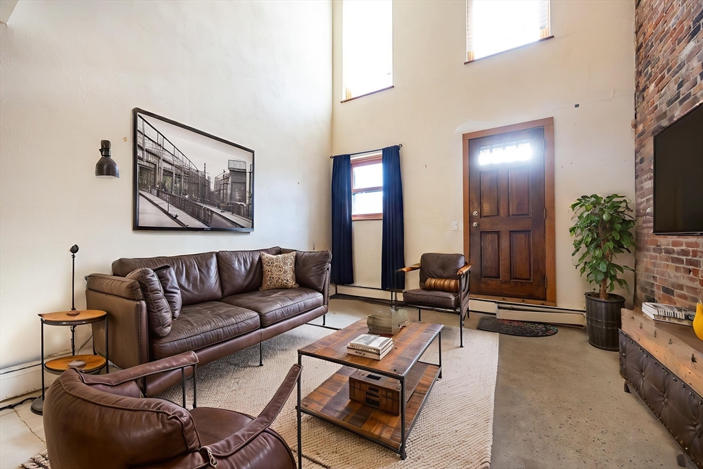 20 Beacon Street, Unit 2 Chelsea, MA 02150 - Photo 2 of 40 a living room with furniture and a fireplace
