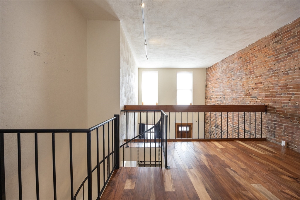 20 Beacon Street, Unit 2 Chelsea, MA 02150 - Photo 24 of 40 a view of hallway with wooden floor