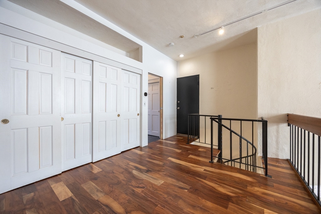 20 Beacon Street, Unit 2 Chelsea, MA 02150 - Photo 26 of 40 a view of a hallway with wooden floor and entryway
