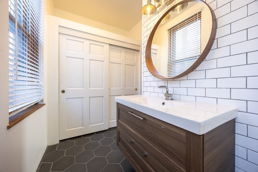 20 Beacon Street, Unit 2 Chelsea, MA 02150 - Photo 31 of 40 a bathroom with a sink and a mirror