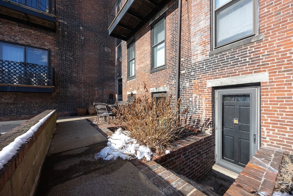 20 Beacon Street, Unit 2 Chelsea, MA 02150 - Photo 35 of 40 a view of a backyard of the house