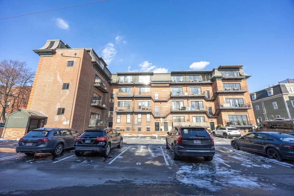 20 Beacon Street, Unit 2 Chelsea, MA 02150 - Photo 38 of 40 a view of a cars park in front of a building