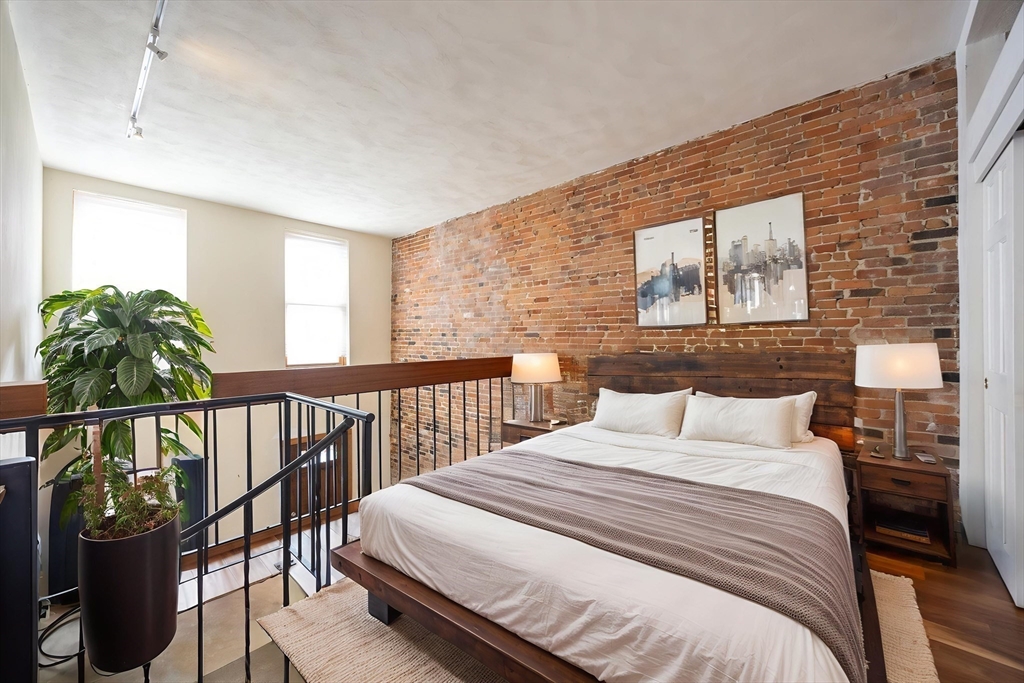 20 Beacon Street, Unit 2 Chelsea, MA 02150 - Photo 4 of 40 a bedroom with a bed and a window