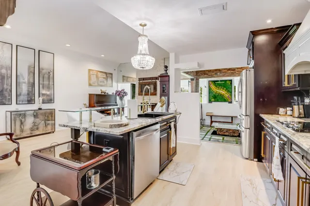a kitchen with a sink stove and cabinets