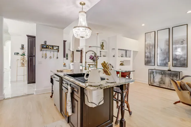 a view of a kitchen center island cabinets and stainless steel appliances