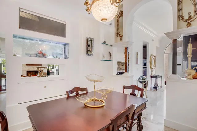 a dining room with furniture and wooden floor