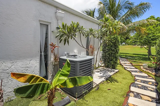 a view of a backyard with swimming pool